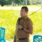 Foto: Bupati Kupang, Yosef Lede, SH., saat memberikan sambutan dalam kegiatan panen raya padi di Desa Tunfeu.